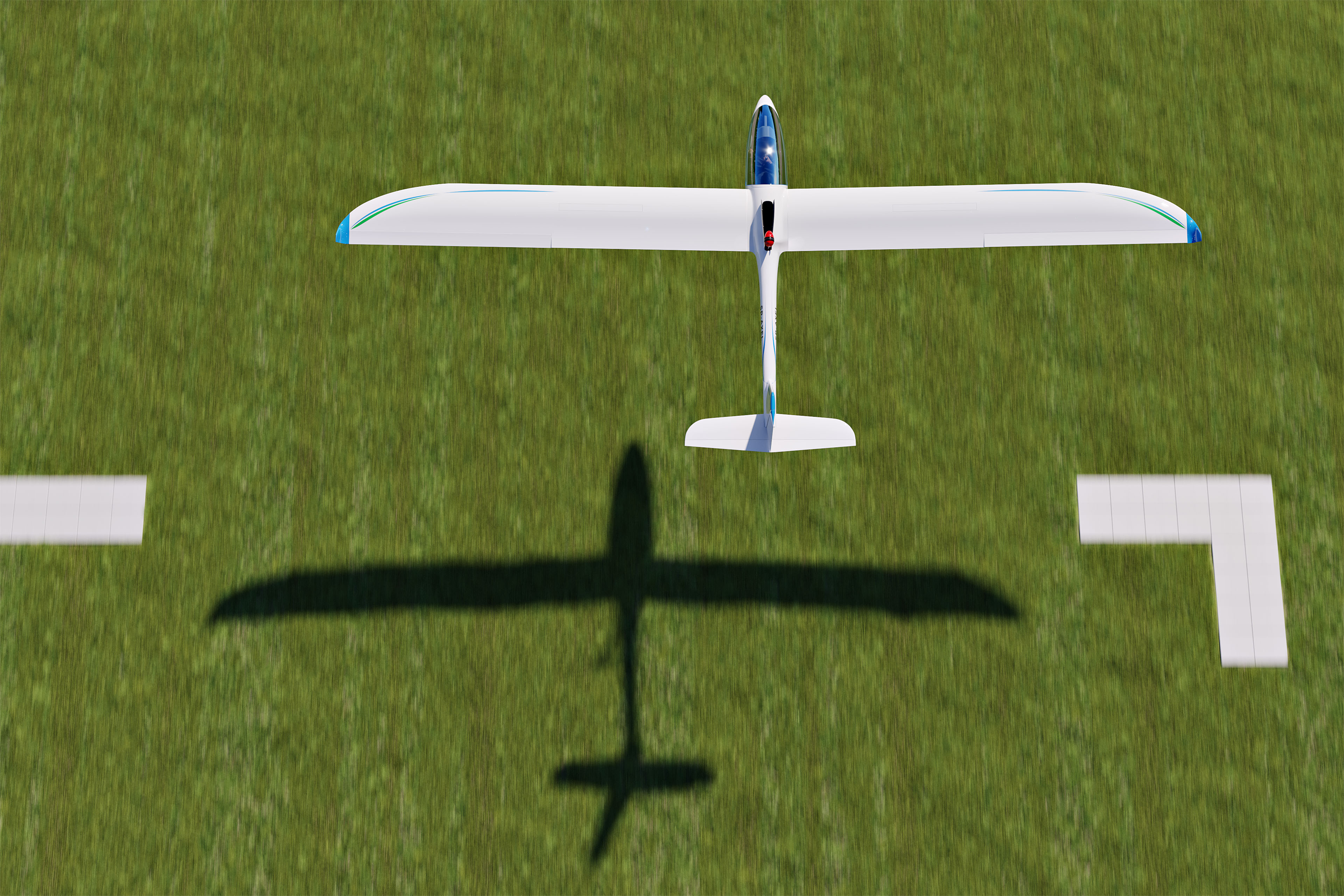 Axel Sailplane take off on grass runway.