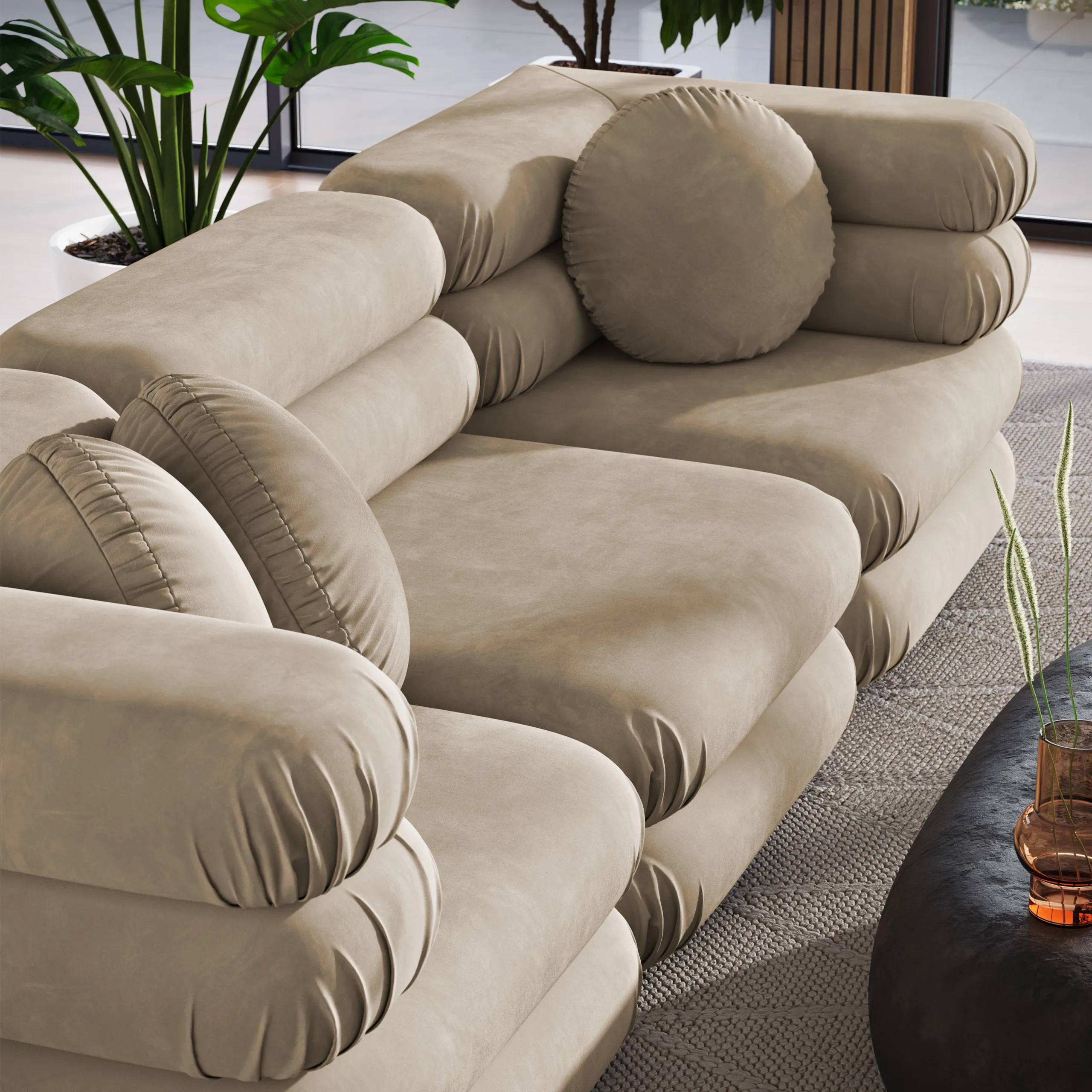 3D product visualization of a modern luxury sectional sofa in a contemporary living room setting. The scene features a light gray sofa with a unique cylindrical design, complemented by a minimalist black coffee table and decorative elements. Large windows and natural lighting enhance the spacious, modern aesthetic, highlighting the sofa's design and texture.