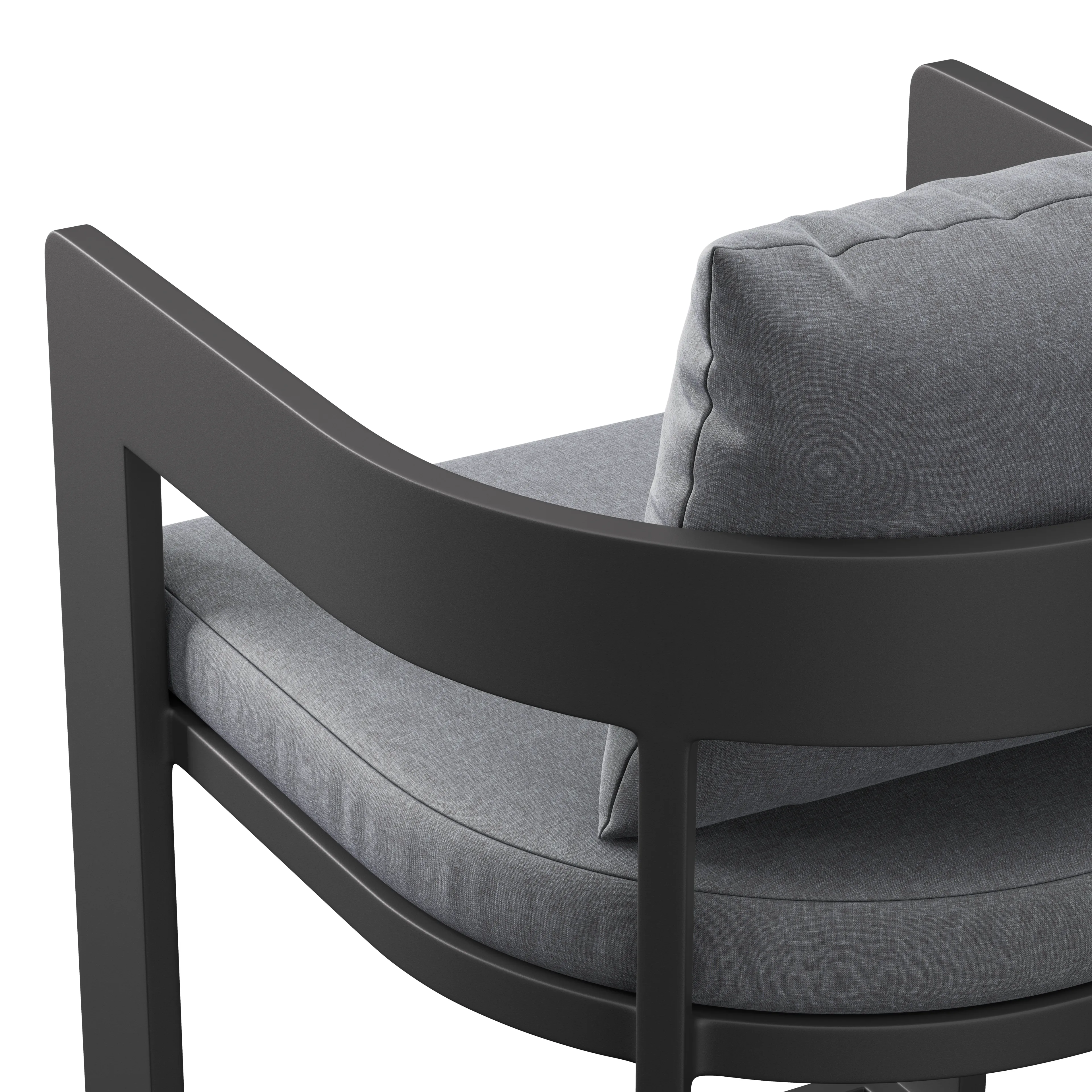 Close-up of a modern chair showing dark matte curved frame and grey upholstered seat cushion with matching back pillow.